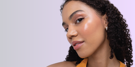 Woman with sparkling skin looking straight to the camera